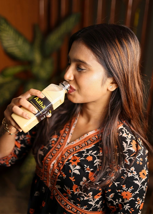 Woman sipping Badam Milk