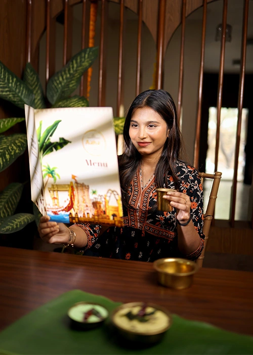 Woman drinking refreshing South Indian filter coffee