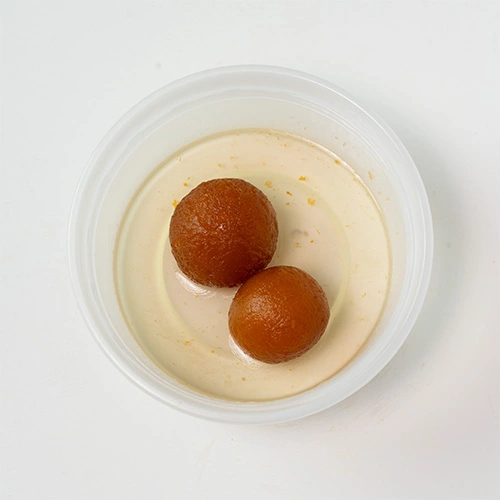 Sweet gulab jamun soaked in sugar syrup