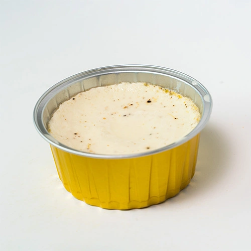 Traditional South Indian junnu made with milk and spices, served as a dessert