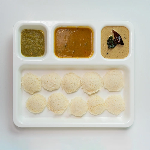 Mini soft idlies served with chutney and sambar