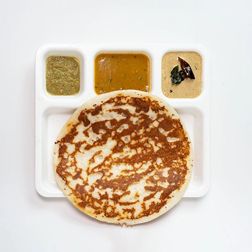 Soft and crispy South Indian uthappam served with chutney