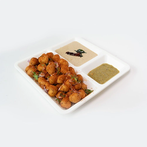 Crispy South Indian punugulu served with chutney and sambar