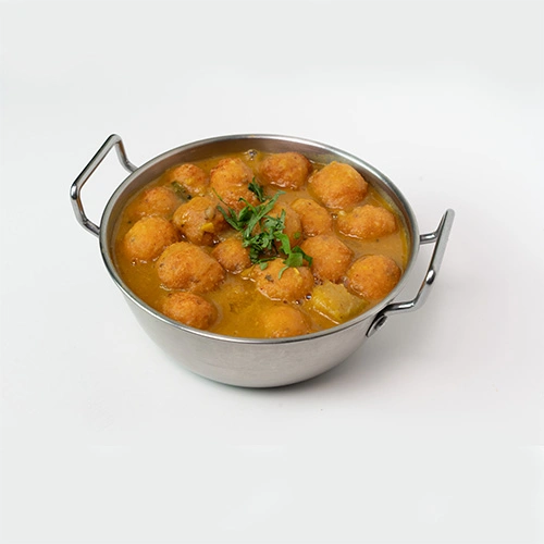 Spicy South Indian punugulu served with sambar and chutney