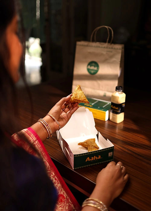 Woman eating South Indian food with a traditional style