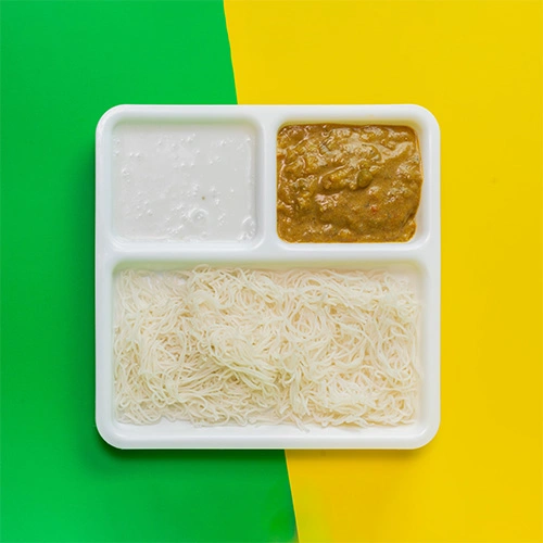 South Indian idiyappam served with coconut milk