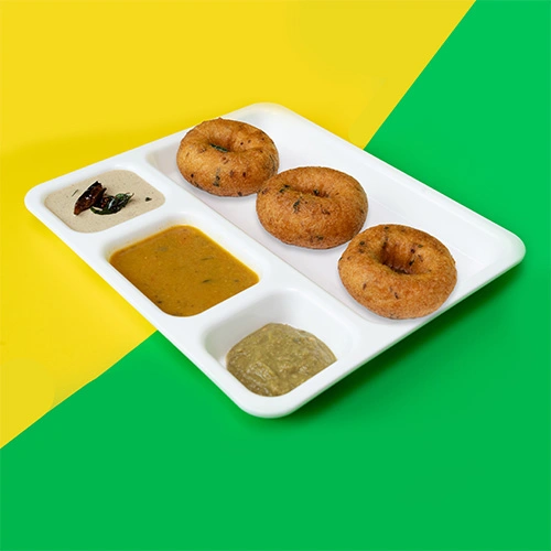 Crispy South Indian vada served with coconut chutney